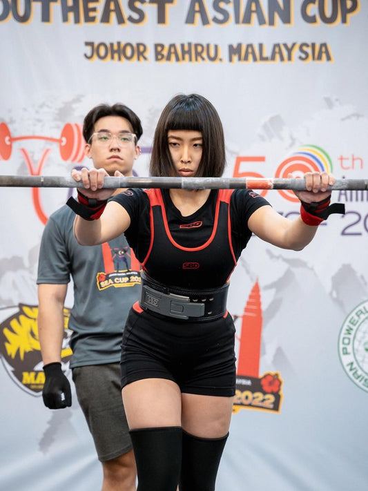 Indonesia Powerlifter, Meiske Dewitania, attempting a squat